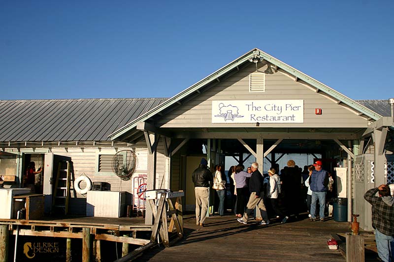 The restaurant sitting on the end of the pier.