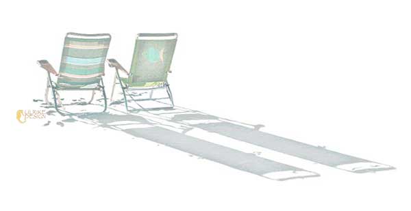 Beach chairs with long shadows.